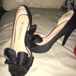 Black, satin, peep toe pump with bow